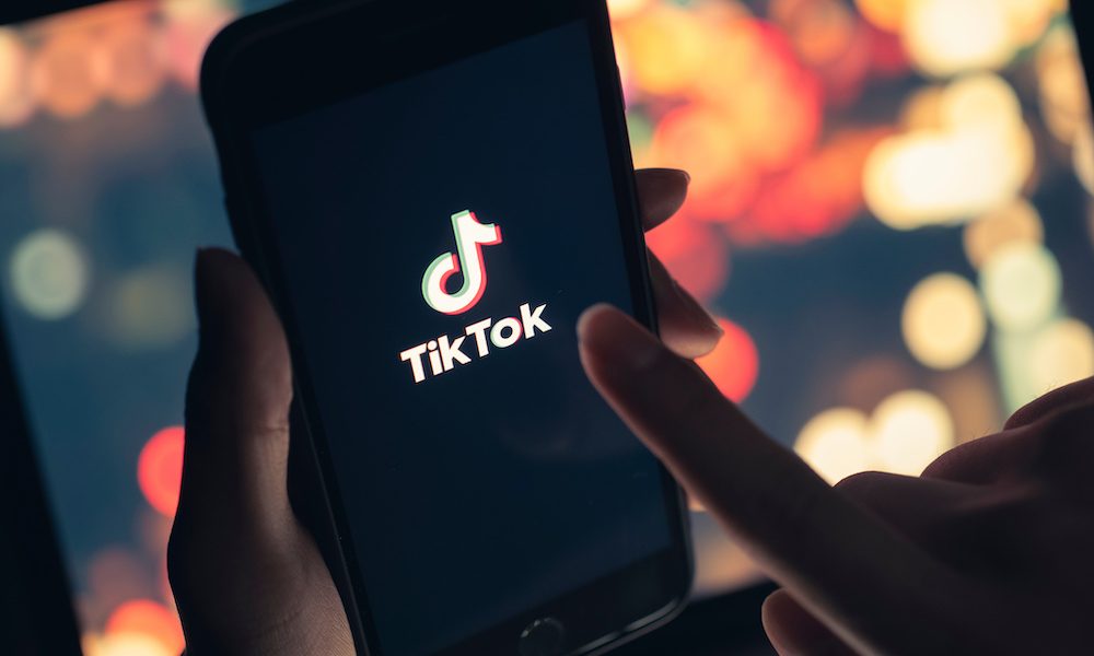 Tik Tok application icon on iPhone 11 pro max screen in hand and have a bokeh for background. Tiktok social media network.May 7, 2021, Bangkok, Thailand How experts are breaking the misinformation cycle online