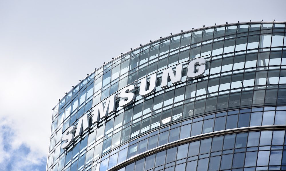 Samsung sign, logo, emblem on the facade of the Samsung Electronics skyscraper tower. WARSAW, POLAND – MAY 15, 2021 Samsung acquires French AI medtech start-up Sonio