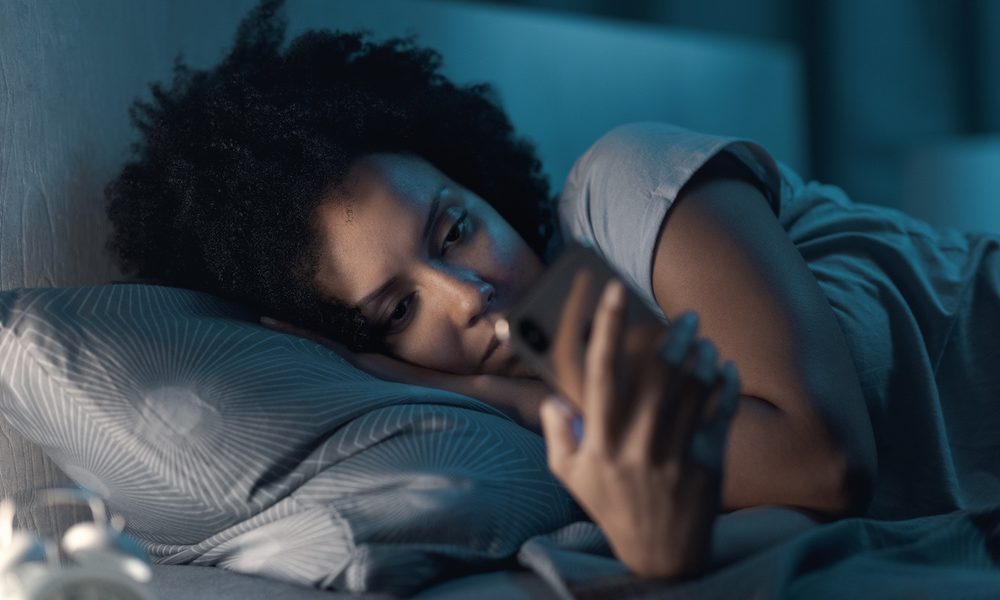 Sleepless woman connecting with her smartphone at night Experts call for ‘robust’ data protection standards after damning report