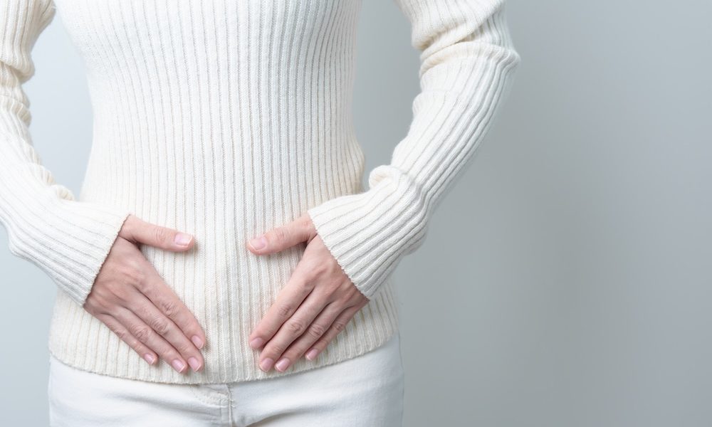 Woman holding her belly. Pregnancy, Reproductive system, menstruation, and gynecology concept Menstrual cycle may contribute to sickle cell disease pain crises, study finds