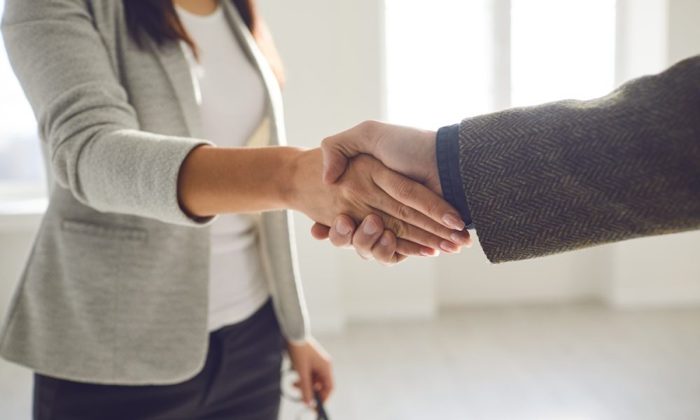 Handshake of businesspeople. Female and male hand makes a handshake in the office. Pelvic health firm’s new CEO