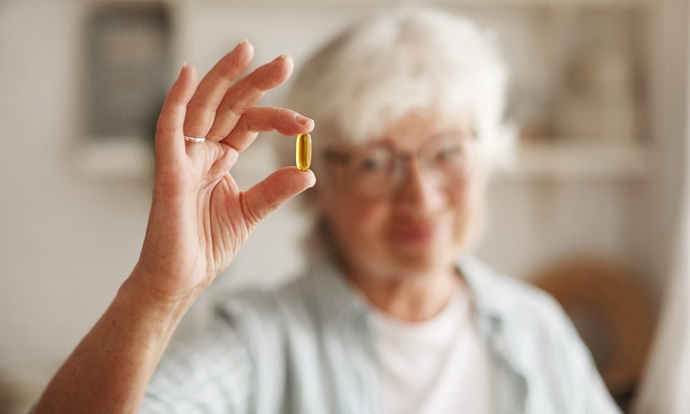 food-nutrition-diet-health-concept-close-up-shot-elderly-woman-s-hand-holding-fish-oil-omega-3-polyunsaturated-fatty-acid-supplement-shape-capsule-going-take-one-lunch Creatine offers menopause benefits, study finds