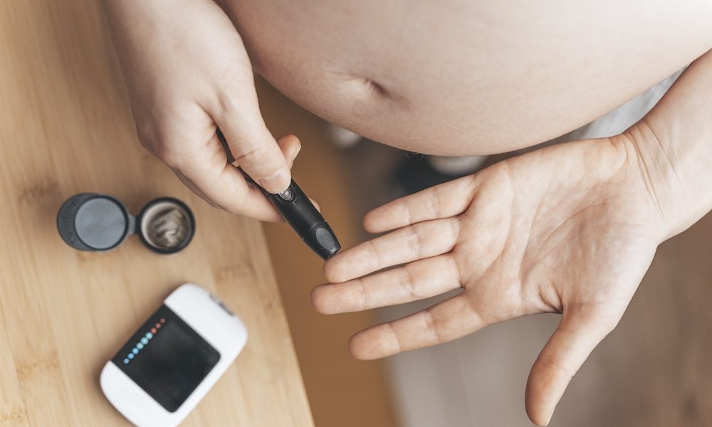 Gestational diabetes in pregnancy. Pregnant woman check sugar level with a glucometer. Glucose intolerance, diabetic fetopathy, hypoglycemia, insulin resistance concept Experts call for better type 2 diabetes care for pregnant women