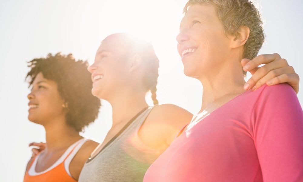 Smiling sporty women looking far away at promenade Breast cancer biosensor and low-cost ultrasound startups win women’s health AI competition