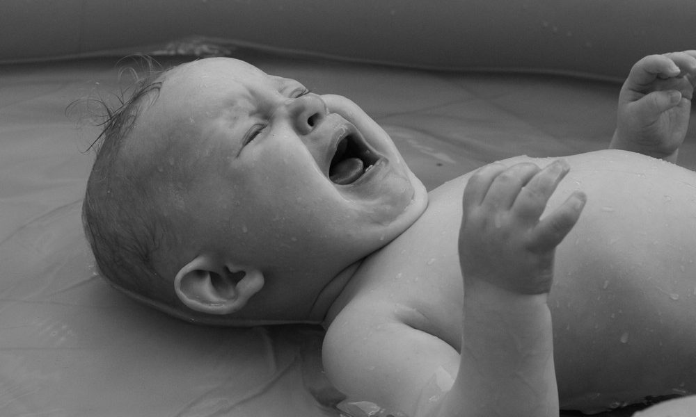 crying-baby-boy-lying-bathtub Scotland’s birth rate hits record low for third year running