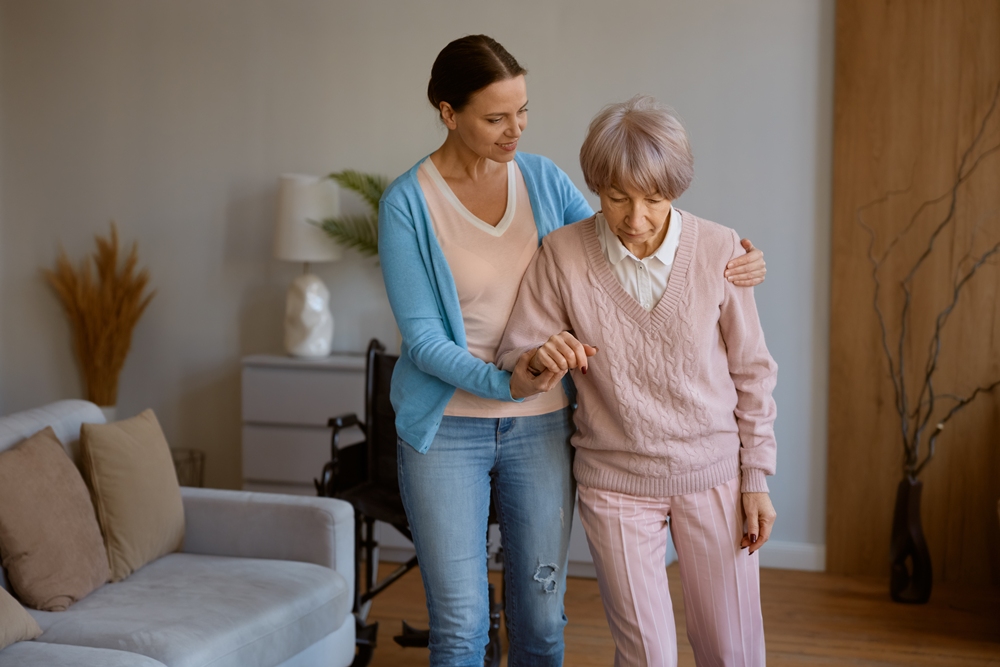 young-daughter-caring-retired-mom-with-physical-mental-disorder Caregiving gap grows as women devote more years to ageing adults